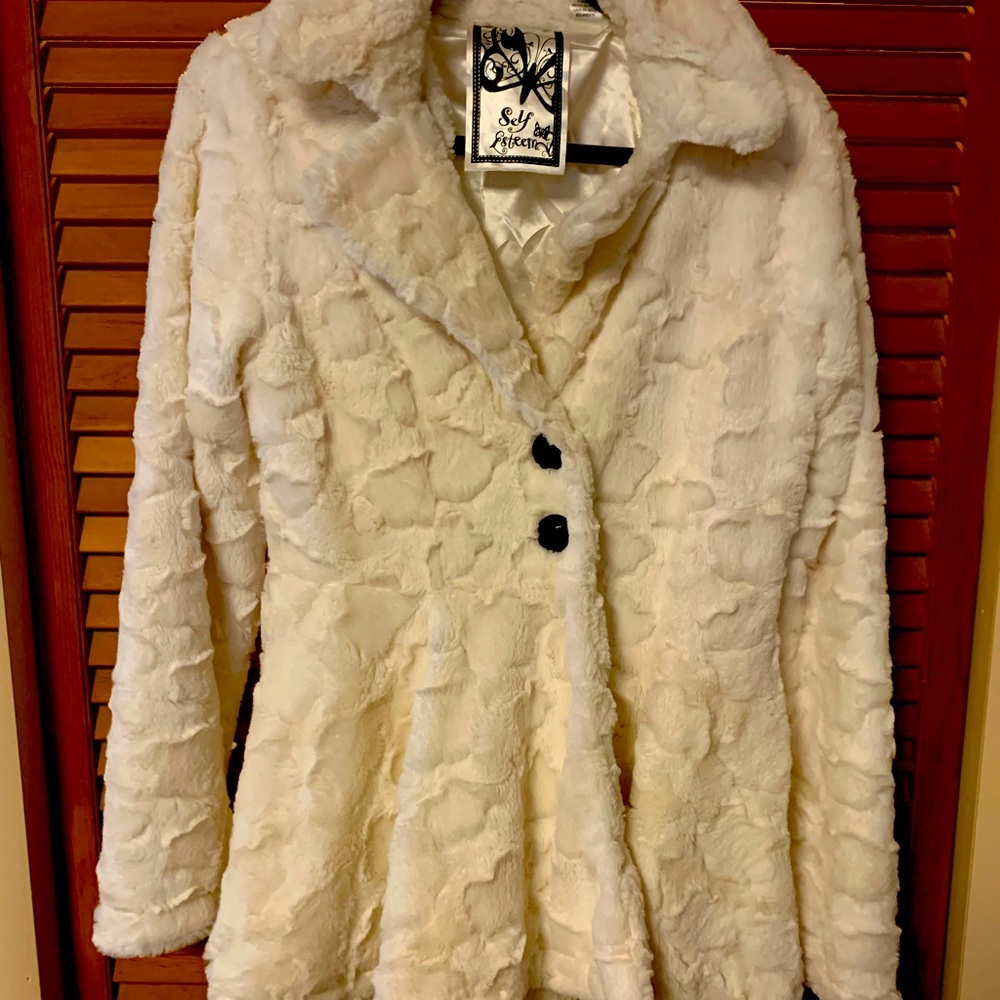 Flirty little faux fur coat. Pair with jeans or dress it up! Soft & cozy!